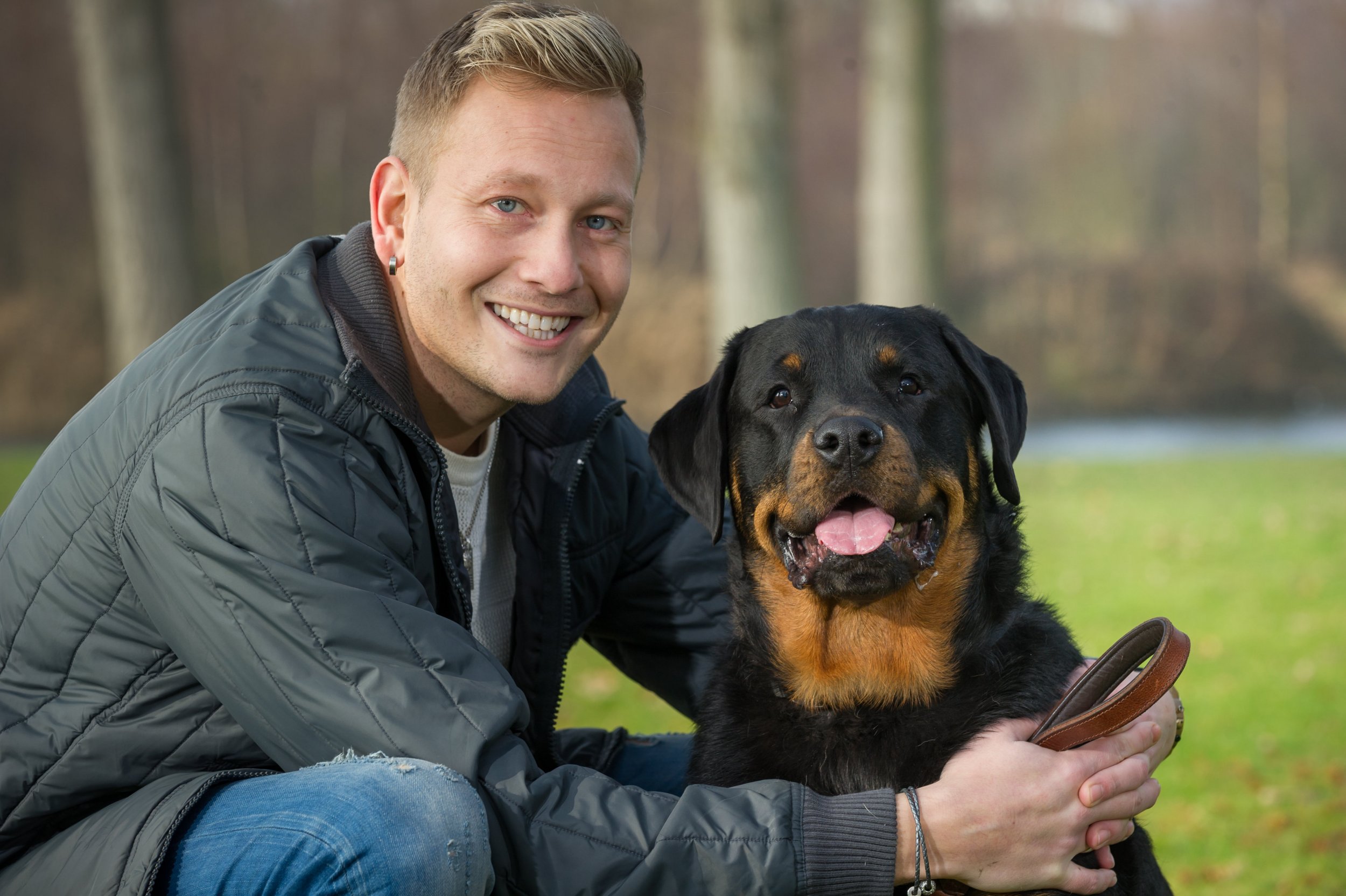 Gary Gregory age 32 from Lowestoft with his Rottweiler Megan age 3 who saved his life by opening the house door to let in the paramedics when Gary was collapsed on the floor. See Masons copy MNDOOR:A man's life was saved by his ROTTWEILER who opened the door to paramedics as he lay lifeless on the floor. Gary Gregory, 32, managed to call 999 moments before passing out because of internal bleeding.Despite help arriving within minutes, ambulance staff feared the worst as they were unable to open the front door and get to him.