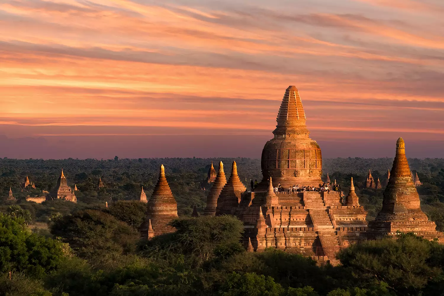 Tourists waiting for sunrise at ancient Pagoda in Old Bagan, Myanmar