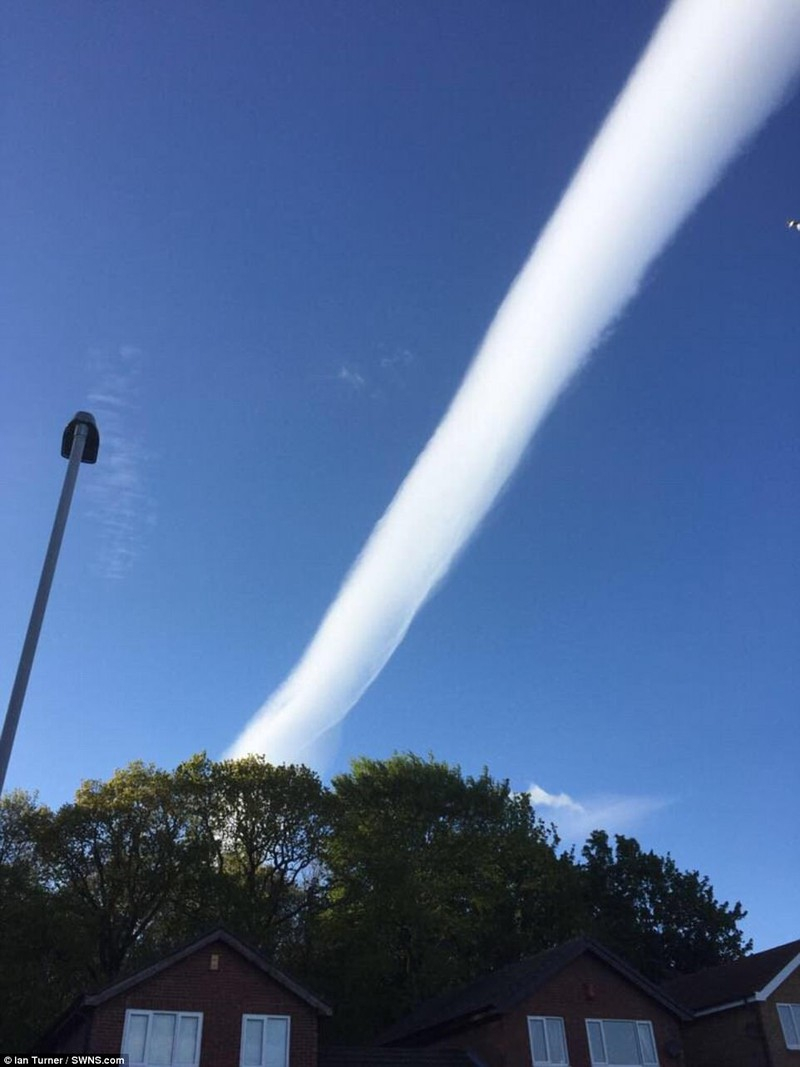 The phenomenon of tubular clouds appearing across the sky