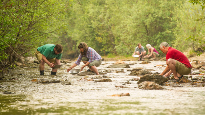 Visitors experience finding gold on the Klondike River