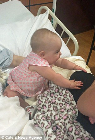 Heartwarming Moment Eight Month Old Girl Leans In To Give Her Newborn Cousin A Clumsy Kiss - And Keeps Kissing