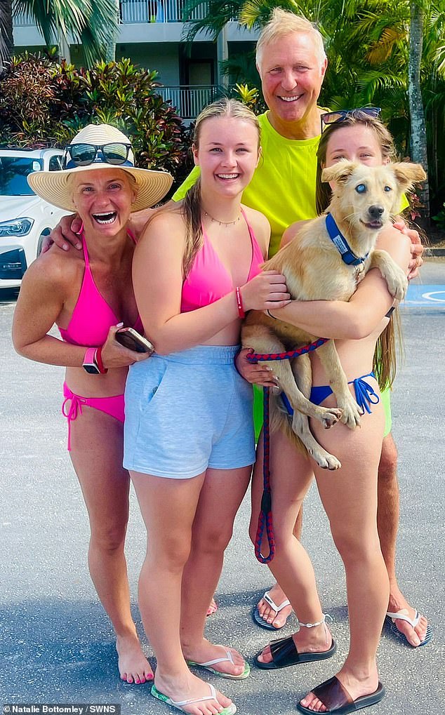 Natalie Bottomley (pictured with her family), 48, said her daughters Taylor, 18, and Georgie, 17, became smitten with eight-month-old Ronnie after arriving on the tropical country, in the Indian Ocean